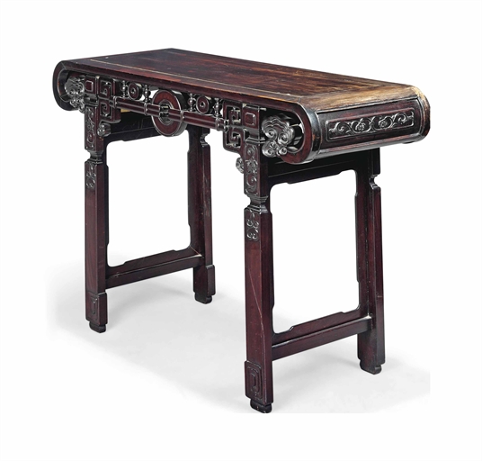 A CHINESE HARDWOOD ALTAR TABLE 
LATE 19TH CENTURY 
THe frieze centered by a bi-disc 
33¼ in. (84.5