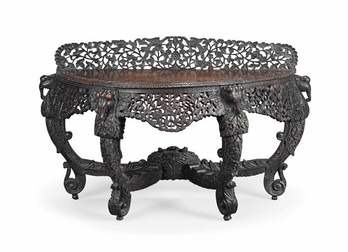 AN INDIAN 'BLACKWOOD' SIDE TABLE 
LATE 19TH CENTURY 
Carved with foliage, scrolls, birds and