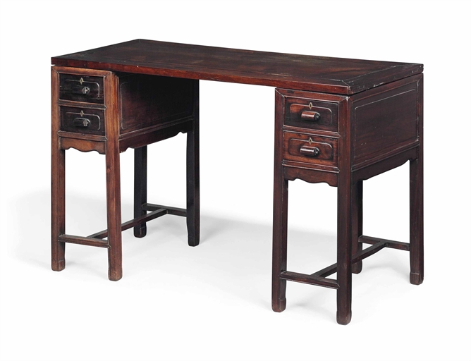 A CHINESE ROSEWOOD PEDESTAL DESK 
MID-20TH CENTURY 
With framed removable top, each panelled