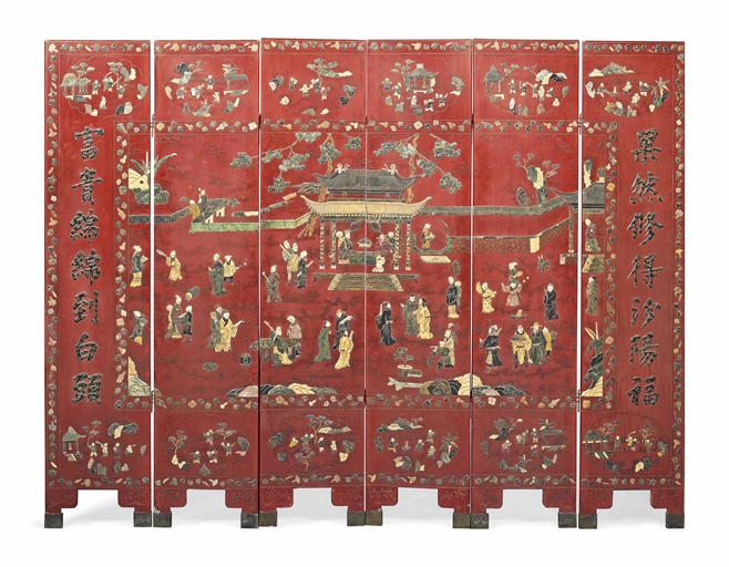 A CHINESE RED LACQUER, SOAPSTONE AND SPECIMEN INLAID SIX FOLD SCREEN 
LATE 19TH CENTURY 
Decorated