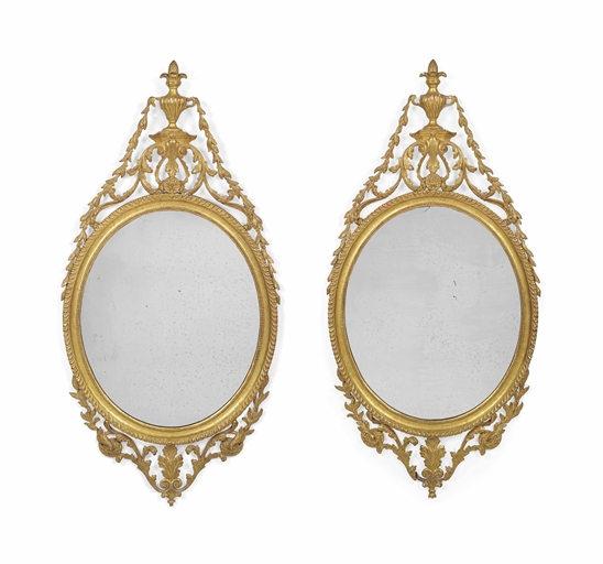 A PAIR OF LATE VICTORIAN GILTWOOD MIRRORS 
LATE 19TH CENTURY 
Each with gadrooned border to the oval