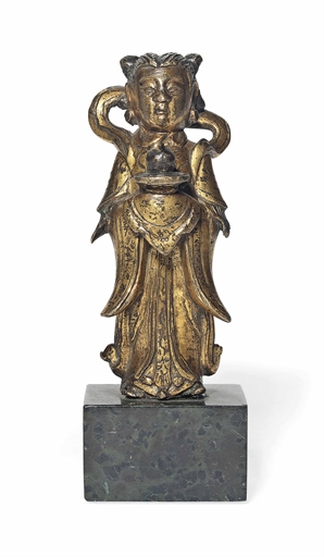 A CHINESE GILT-BRONZE MODEL OF AN IMMORTAL 
MING DYNASTY, 17TH CENTURY 
The figure modelled standing