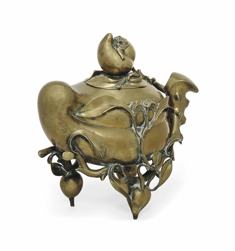 A LARGE CHINESE BRONZE CENSER AND COVER 
19TH CENTURY 
Shaped as a fruiting peach, supported on a