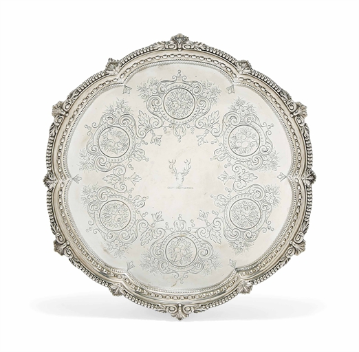 A VICTORIAN SILVER SALVER 
MARK OF GOLDSMTIHS & SILVERSMITHS CO., LONDON, 1894 
Shaped circular,