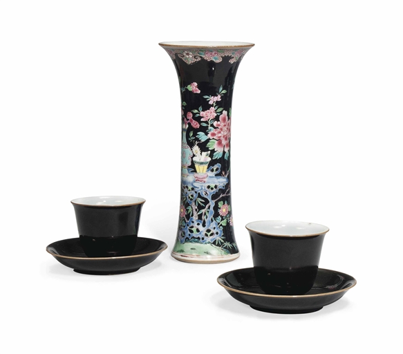 A CHINESE FAMILLE ROSE BLACK-GROUND VASE AND A PAIR OF BLACK-GLAZED CUPS AND SAUCERS
YONGZHENG