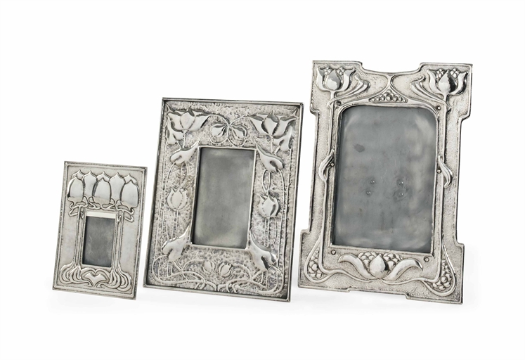 A SILVER-PLATED METAL ARTS AND CRAFTS PICTURE FRAME 
CIRCA 1905 
Embossed with stylised flowers,