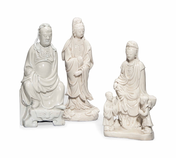 THREE CHINESE DEHUA FIGURES 
18TH CENTURY 
Comprising a Guanyin standing on lotus on waves; a