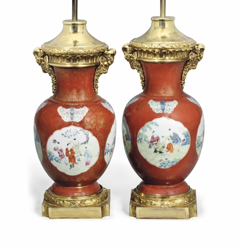 A PAIR OF CHINESE CORAL-GROUND FAMILLE ROSE BALUSTER VASES 
THE PORCELAIN QIANLONG/JIAQING PERIOD (