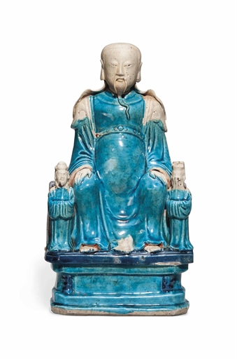 A CHINESE TURQUOISE-GLAZED FIGURAL GROUP 
17TH CENTURY 
Modelled as a dignitary with turquoise-