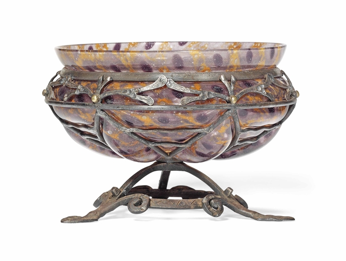 A LOUIS MAJORELLE AND DAUM GLASS AND WROUGHT-IRON BOWL 
CIRCA 1920 
The mottled glass blown into a