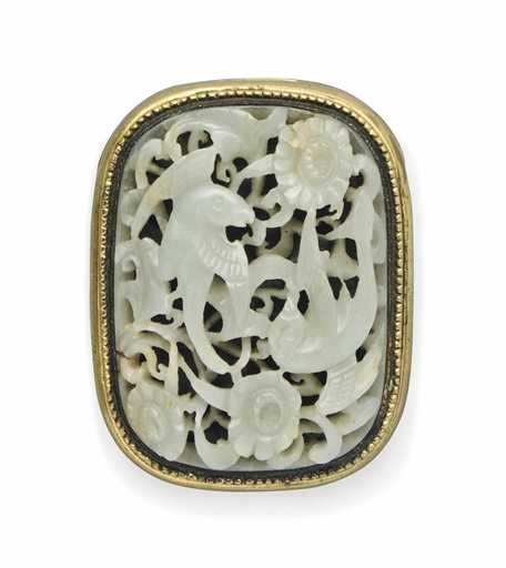 A CHINESE PALE CELADON JADE PLAQUE 
THE JADE, 19TH CENTURY 
Of rounded rectangular form, carved