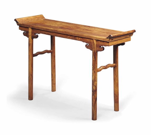 A SMALL CHINESE ROSEWOOD ALTAR TABLE 
LATE 20TH CENTURY 
The panelled top with everted scroll ends