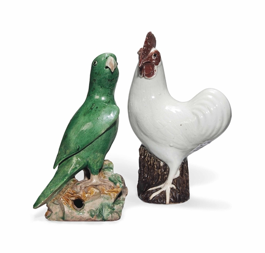 A CHINESE GREEN-GLAZED PARROT AND A WHITE-GLAZED COCKEREL 
KANGXI PERIOD (1662-1722) AND LATER