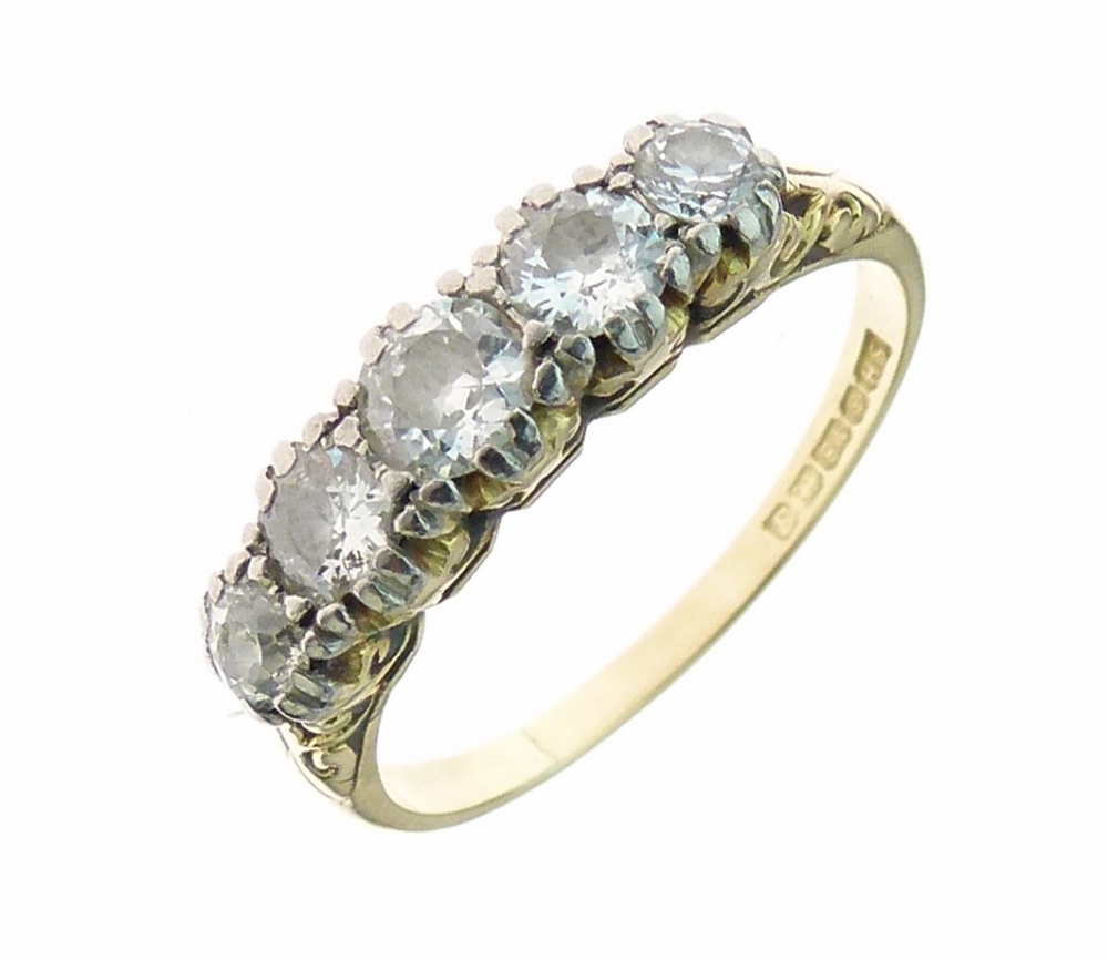 Five stone diamond 18ct gold ring, the graduated brilliant cuts totalling approximately 0.84 carats,