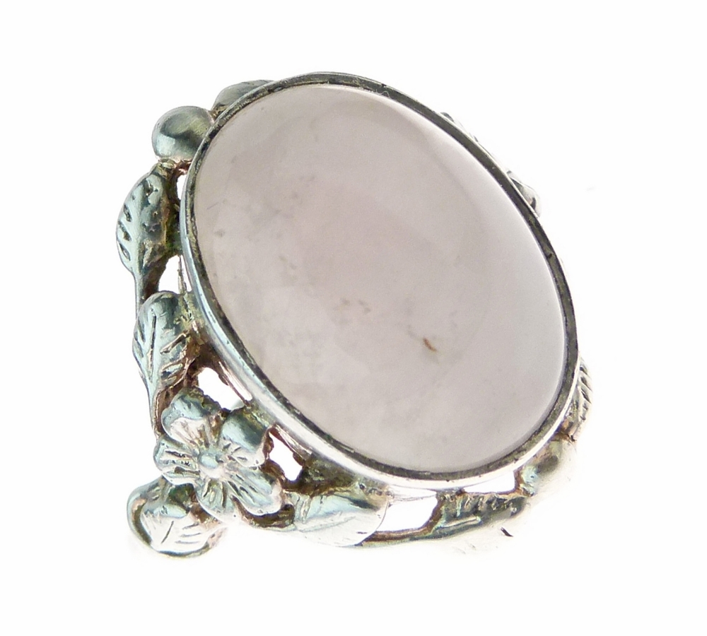 Rose quartz Arts & Crafts silver ring attributed to Bernard Instone, the cabochon enclosed by
