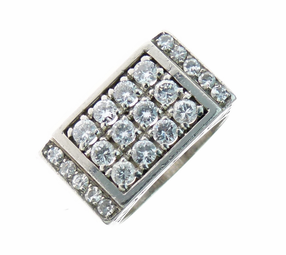 Diamond cluster ring, the central panel set with twelve brilliant cuts arranged in three rows,