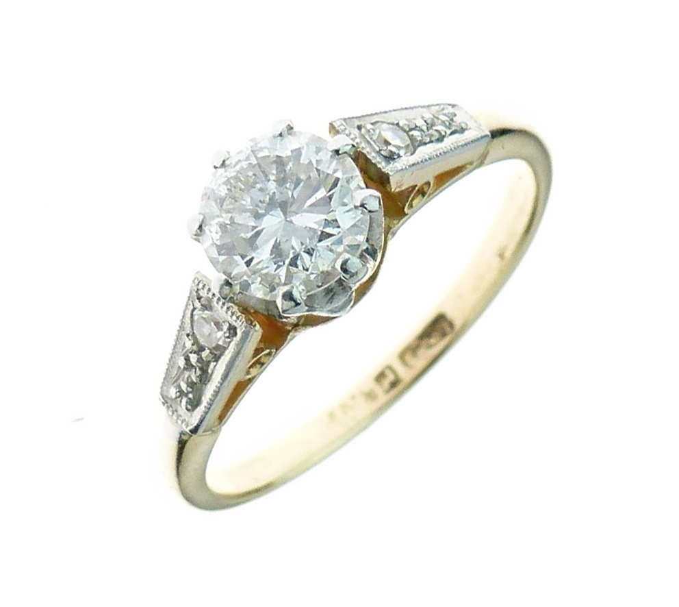 Diamond single stone ring, the brilliant cut of approximately 0.65 carats, with a single cut diamond