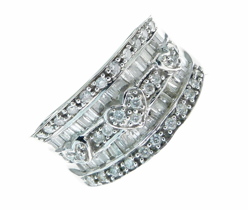 Diamond set 14ct white gold ring, the two rows of baguettes punctuated by three diamond set heart