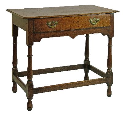 George III oak side table fitted one long drawer, shaped frieze below and standing on turned