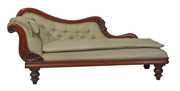 Victorian mahogany framed chaise longue having carved decoration and standing on tapered turned