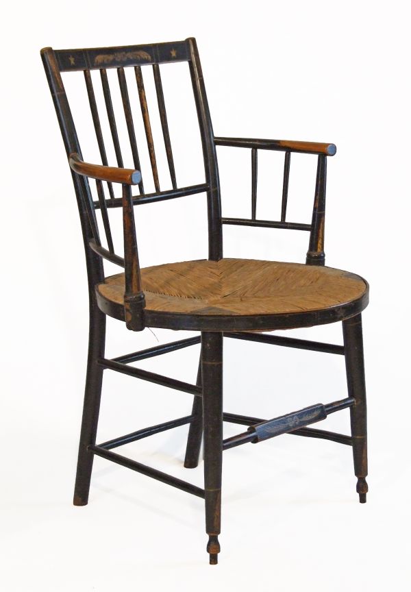 19th Century painted beech stickback open arm elbow chair having a circular rush seat and standing