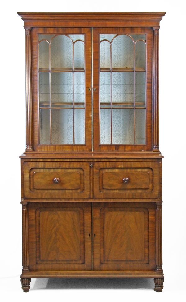 Regency mahogany two section secretaire bookcase attributed to Gillows, the upper section with