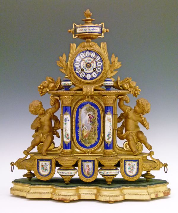 19th Century French gilt spelter and porcelain cased mantel clock having figural decoration