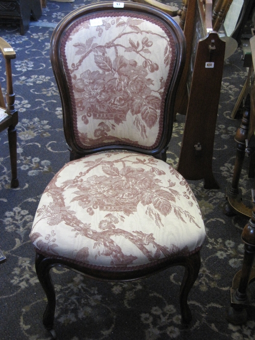 An upholstered 19th century style occasional chair.