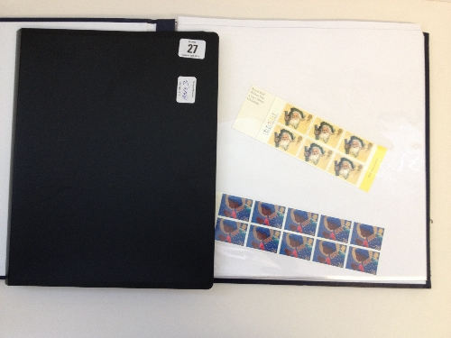 An album containing various GB Mint Christmas Stamps together with an album containing stamps: The