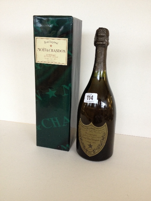 A bottle of 1976 Moet & Chandon Champagne together with a later bottle of Moet & Chandon in box (