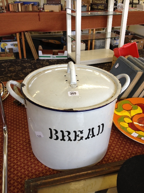 A large white enamel bread bin.