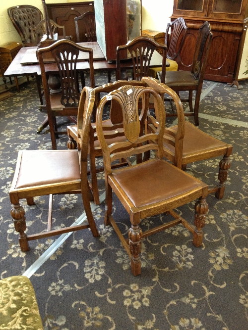 A set of four Art Deco oak framed dining chairs.