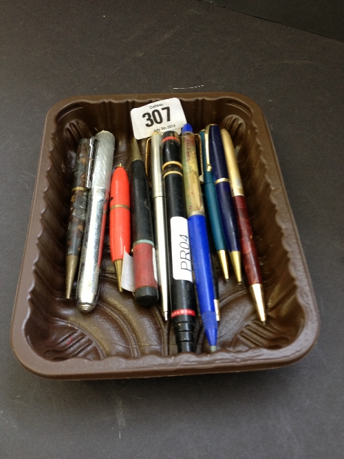 A box of pens and pencils.