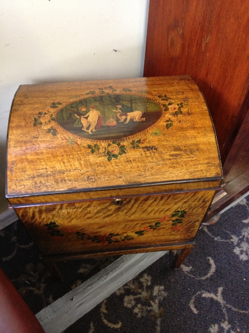 A pair of Continental style wine coolers with painted and applied decoration to front and tops.