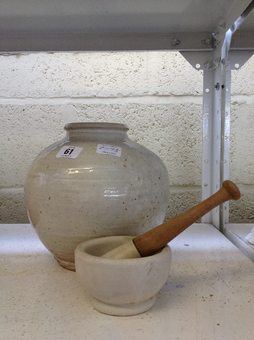 An Art Pottery vase dated 1951 to base together with a small pestle and mortar.