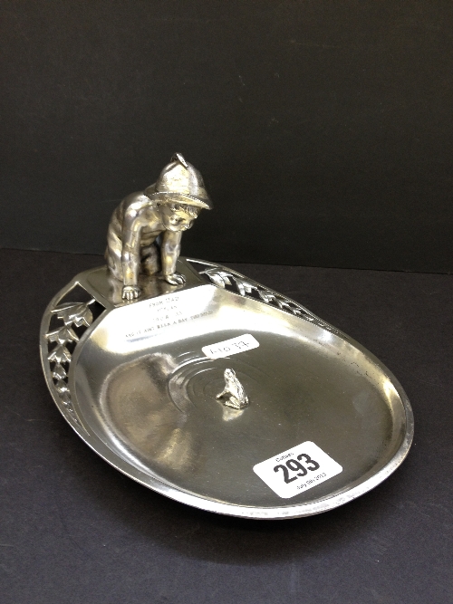 A WMF silver metal card tray modelled as a Young Boy Kneeling on the Side of a Pond with a Frog in