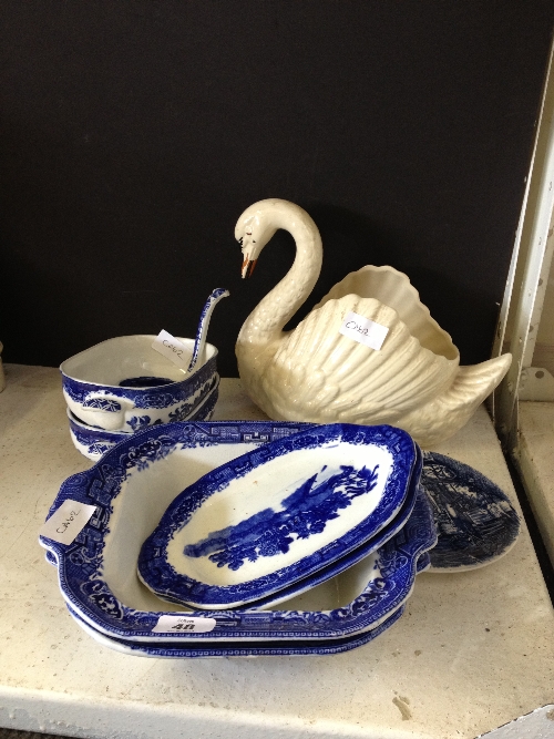 A small quantity of blue and white china together with a Dartmouth Pottery Swan.