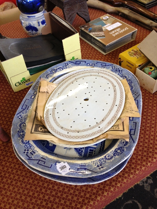 Two large 19th century blue and white Willow pattern meat plates together with two drainers (