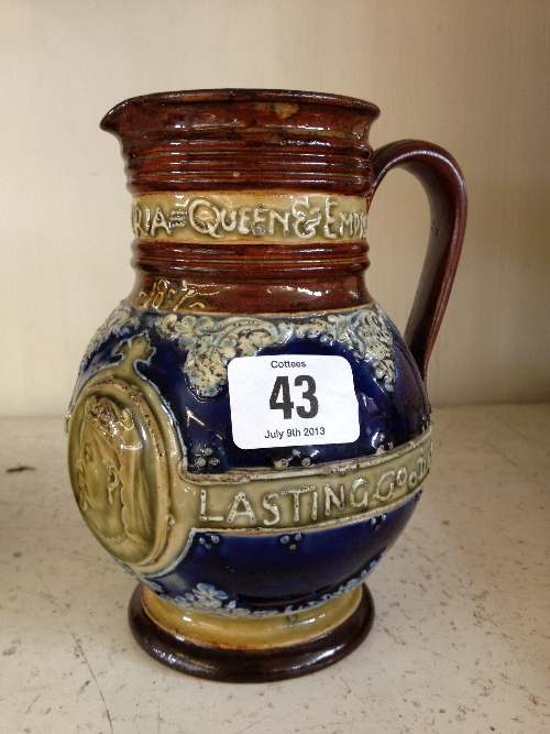 A Doulton Lambeth Queen Victoria commemorative jug inscribed ``She wrought her people lasting good``