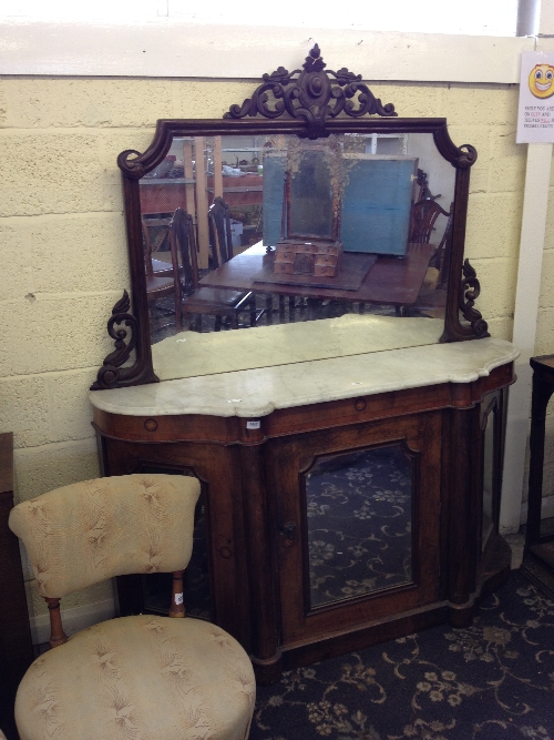 A 19th century walnut and satin wood inlaid marble topped sideboard with mirror back.