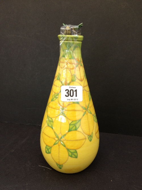 A Sally Tuffin Dennis Chinaworks bottle shaped flask with bee finial decorated in the Yellow Blossom