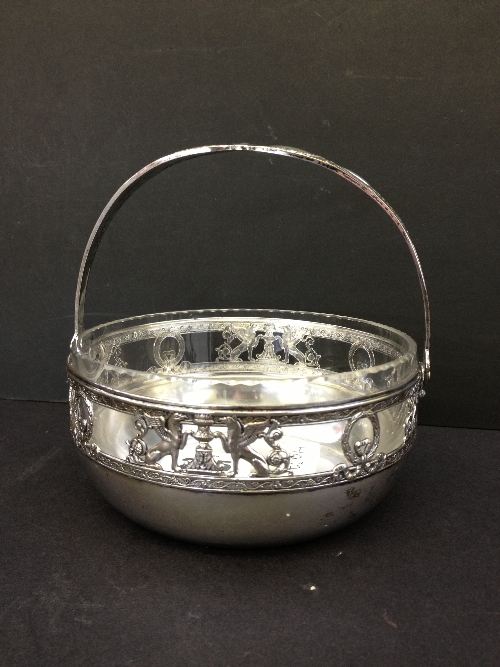 A WMF silver metal sugar bowl with swing handle decorated with Griffins in the Classical manner with