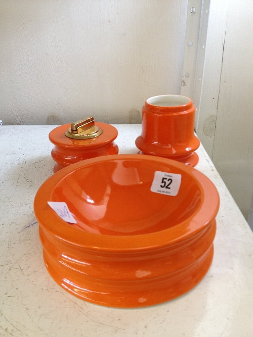 Three various orange glazed Carlton Ware smoker`s items including ashtray, cigarette lighter and