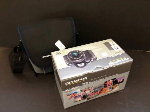 An Olympus 420 modern camera in original case with carrying case.