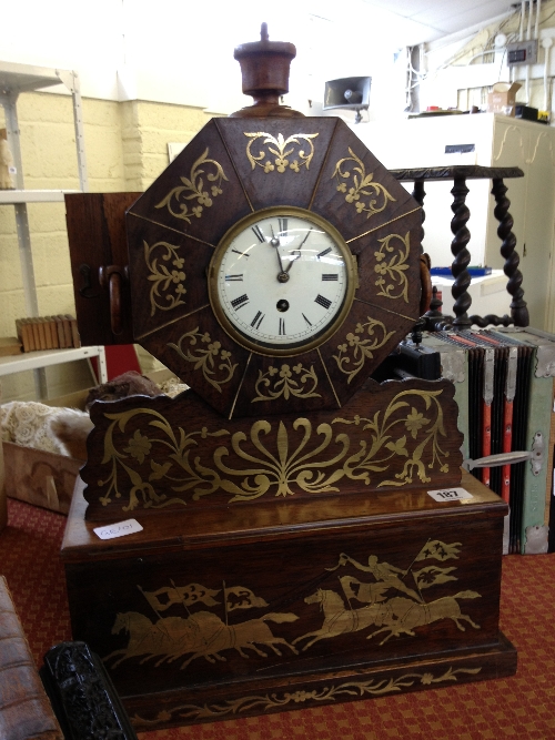 An unusual late 19th century mantle clock with brass inlaid Running Horse decoration and French