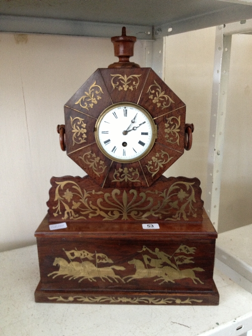 An unusual late 19th century mantle clock with brass inlaid Running Horse decoration and French