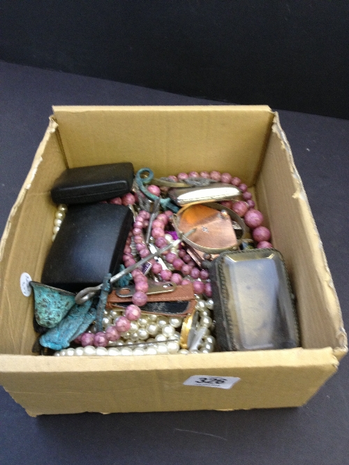 A box containing a quantity of costume jewellery and other items.