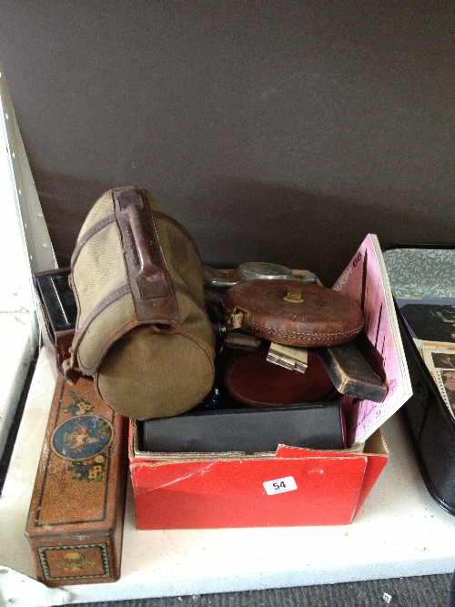 A pair of bowling woods in canvas bag together with tape measures, slide rules and other items.