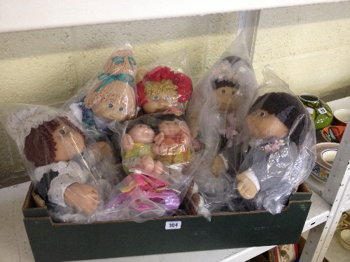 Five various full sized Cabbage Patch dolls together with two small similar.