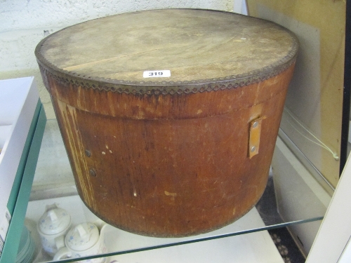 A large wooden metal bound hat box.